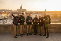 Young travelers exploring vibrant city landmarks at golden hour